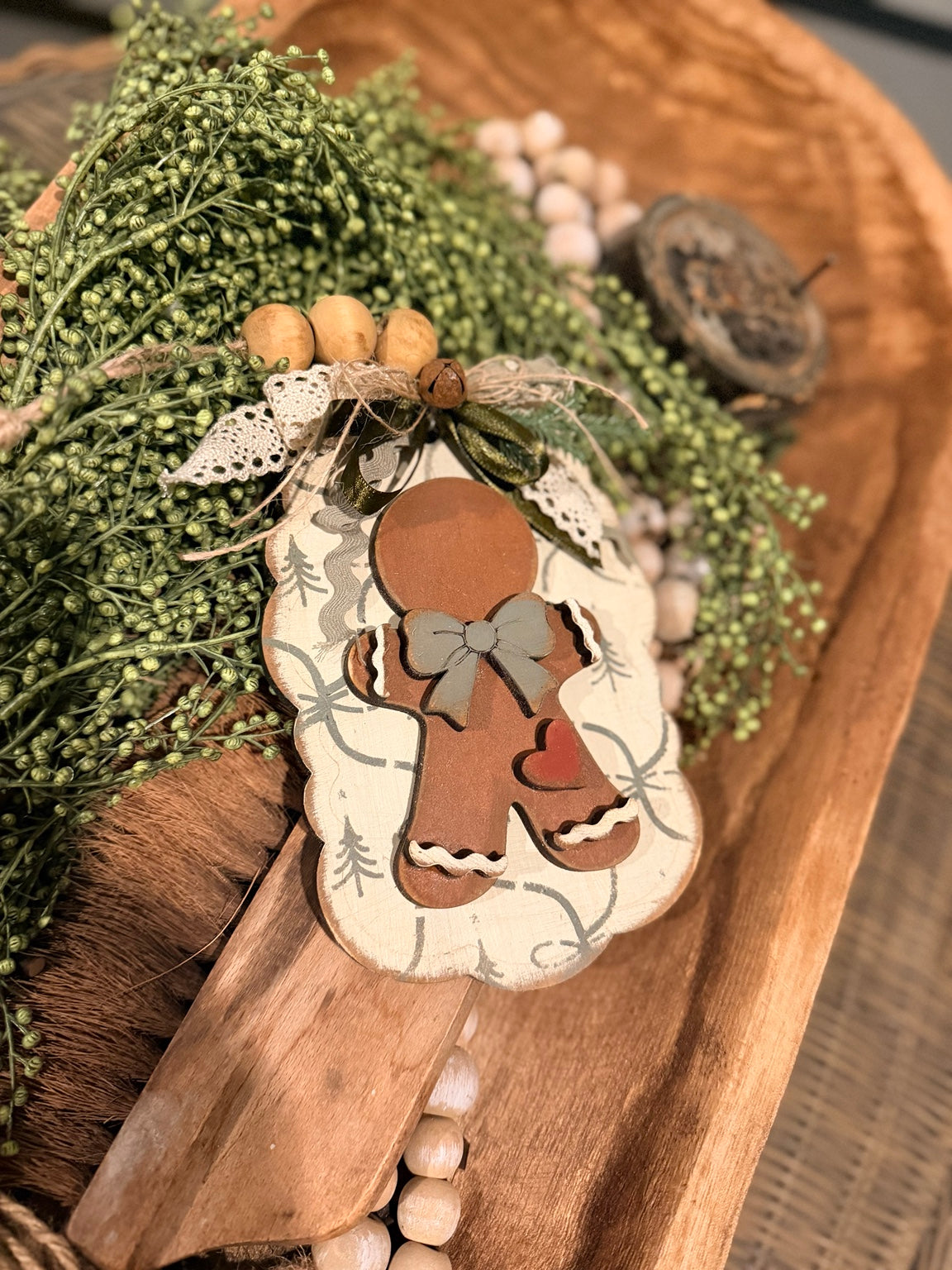 Painted Tattered Little Gingerbread Ornament 824 with sage bow, red heart, and cream icing on a scalloped tag; unfinished DIY wood kit.