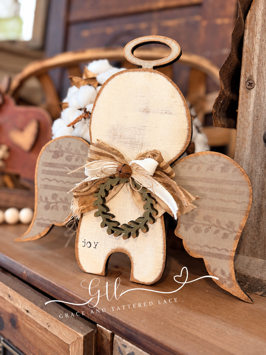 Finished painted Wonky Whimsical Angel 719 with wreath and rustic bow